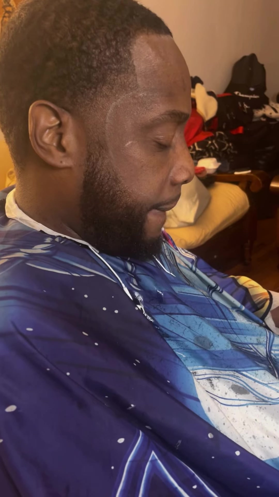 A finished line-up, fade and shaped beard