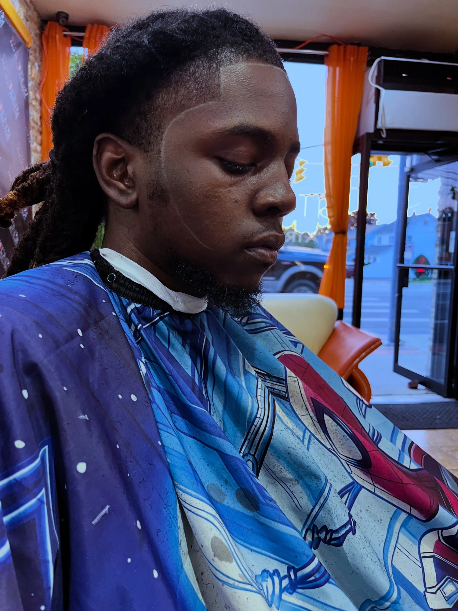 Greg’s sharp line-up and temple taper with locs